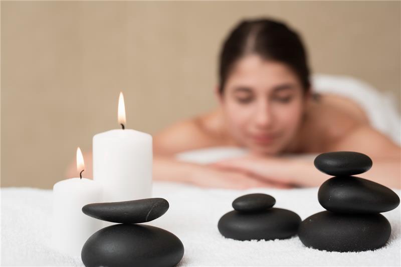 How Does Combining Exfoliation, Warm Stone Therapy, and Aromatherapy Create Deep Wellness?