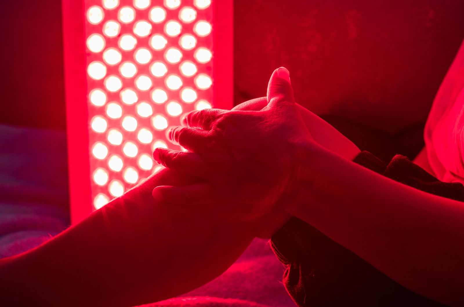 Sports recovery session with red light and lymphatic therapy for improved circulation and flexibility.