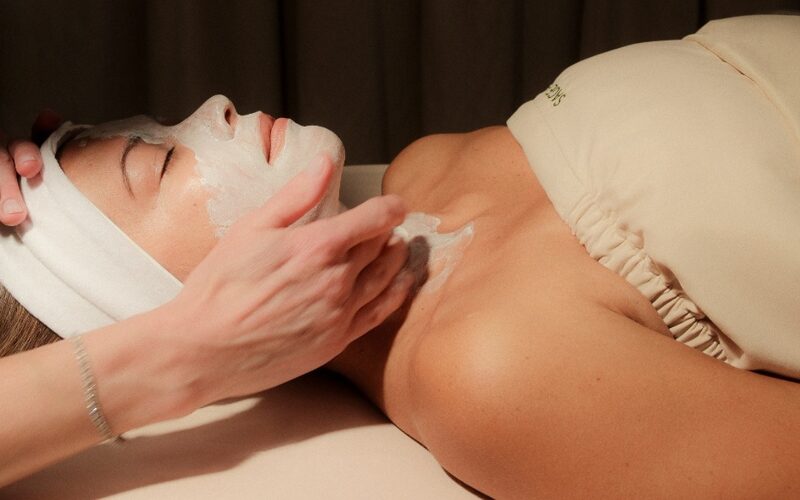Close-up of a soothing facial treatment being applied to a client to rejuvenate stress-worn skin at a spa.
